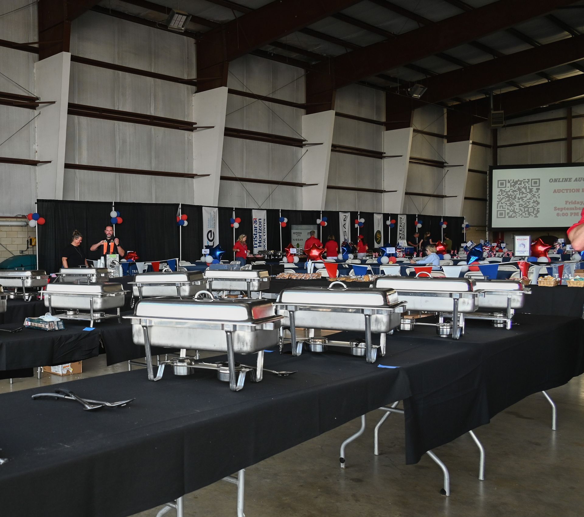 A large room filled with lots of buffet tables