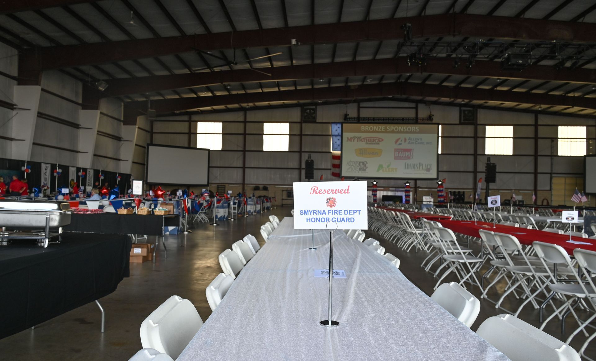 A long table with a sign that says award on it