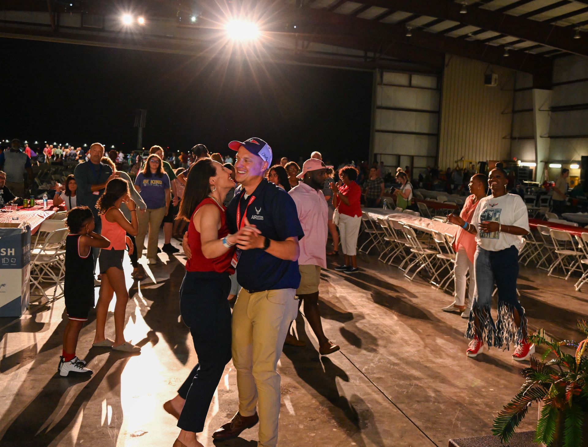 A group of people are dancing on a dance floor.