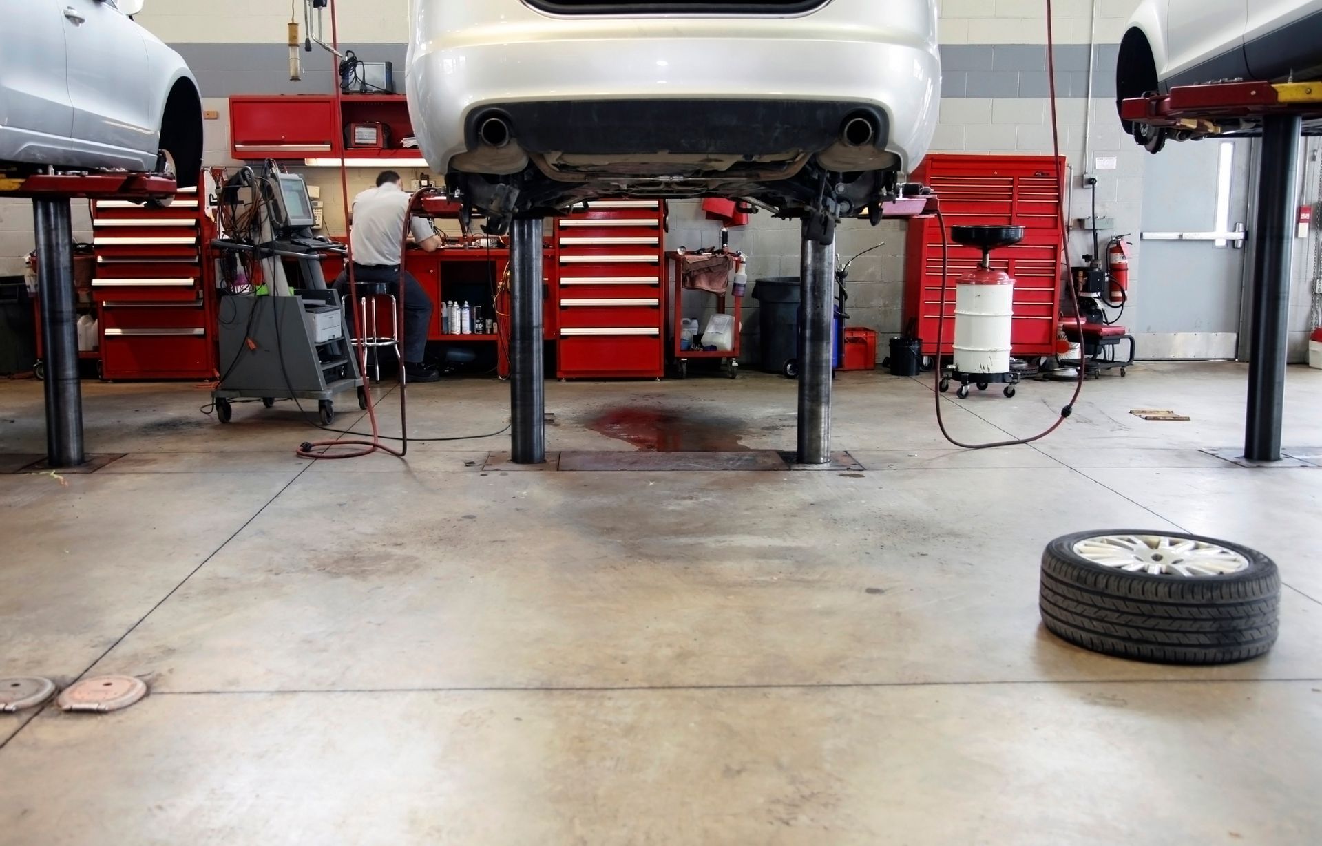 A car is sitting on a lift in a garage
