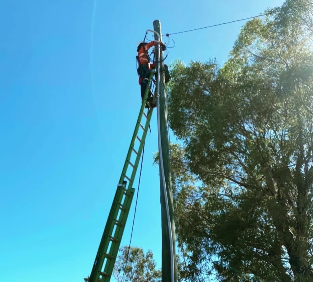 Man Installing Power Line  — Central West Power Construction in Orange, NSW