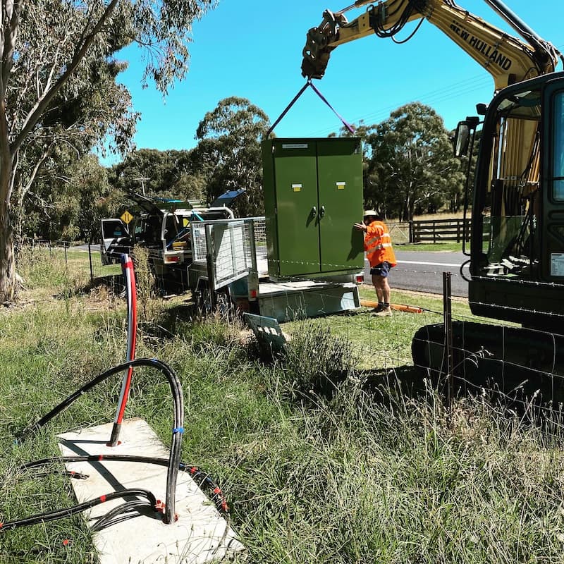 Transformer Box is Carried by Heavy Equipment — Central West Power Construction in Orange, NSW