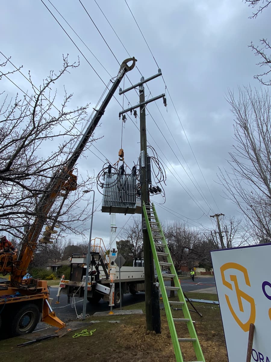 Expandable Ladder Leans on Electric Pole  — Central West Power Construction in Orange, NSW