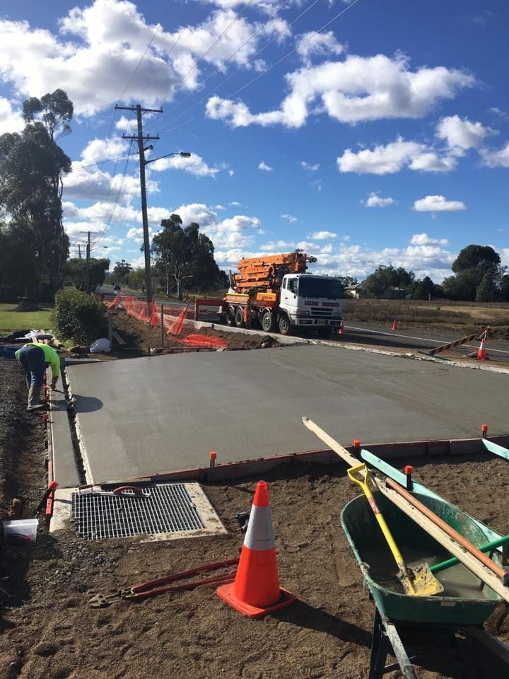 A Construction Site With a Truck and a Wheelbarrow — LVL Constructions in Newcastle, NSW