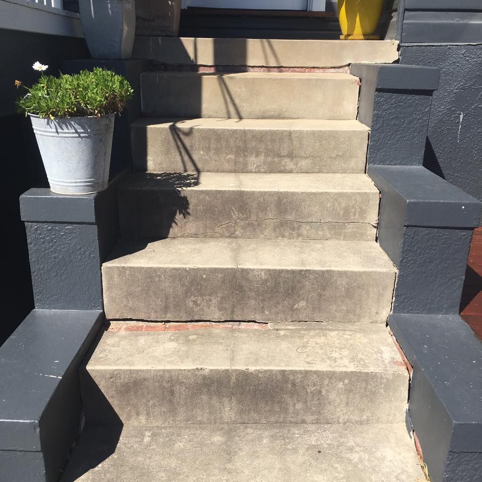 A Potted Plant Sits on the Steps of a House — LVL Constructions in Newcastle, NSW