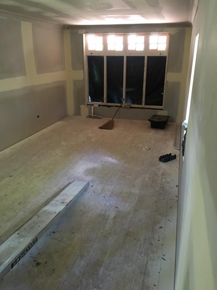 An Empty Room With a Window and a Broom in It — LVL Constructions in Newcastle, NSW
