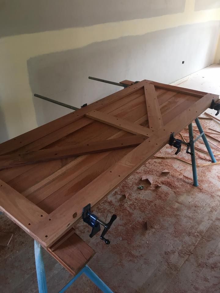 A Wooden Door is Being Built on a Workbench in a Room — LVL Constructions in Newcastle, NSW