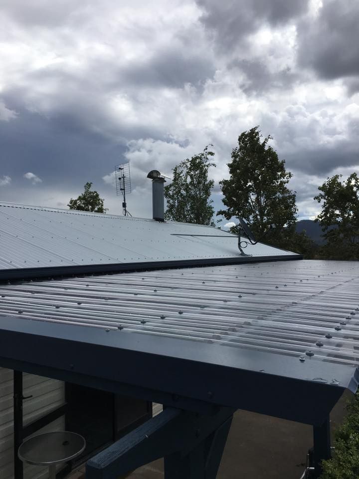 A Roof With a Chimney on It and a Cloudy Sky in the Background — LVL Constructions in Newcastle, NSW