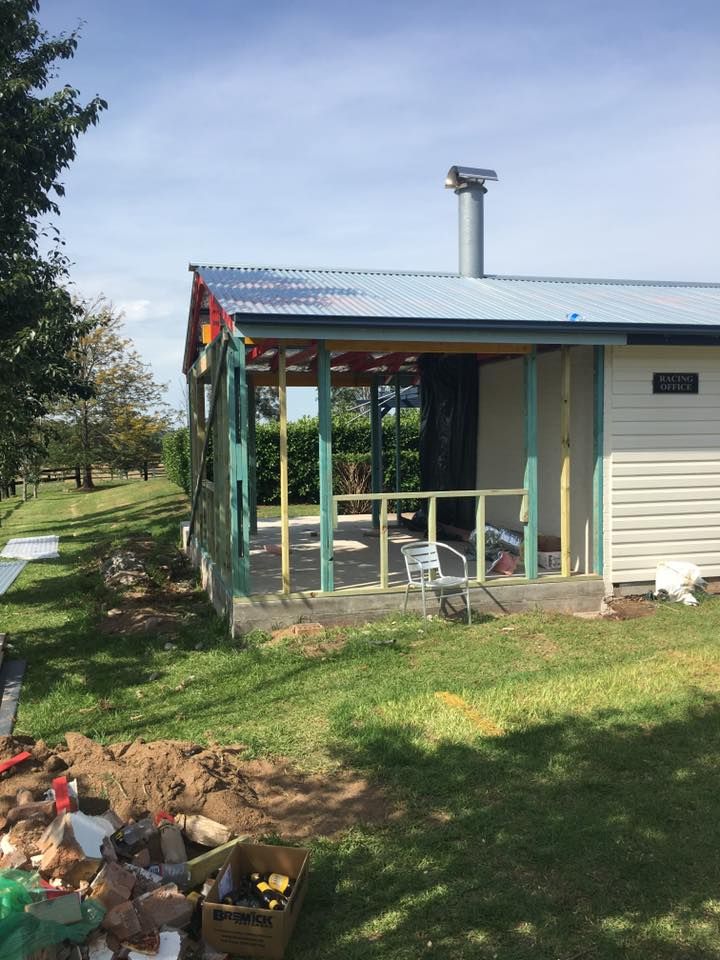 A Small House With a Porch and a Chimney on the Roof — LVL Constructions in Newcastle, NSW