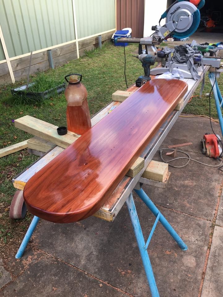 A Wooden Board is Sitting on Top of a Wooden Table — LVL Constructions in Newcastle, NSW