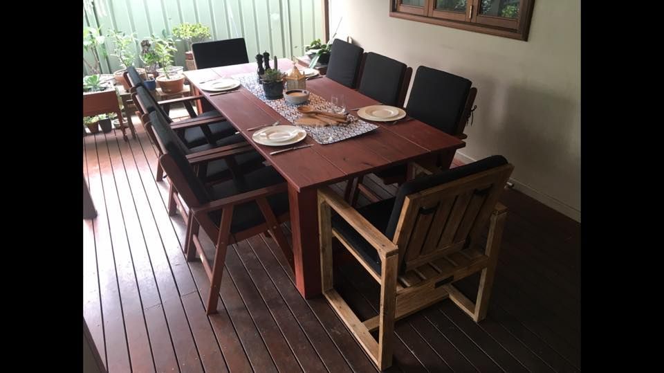 A Wooden Table and Chairs Are Sitting on a Wooden Deck — LVL Constructions in Newcastle, NSW