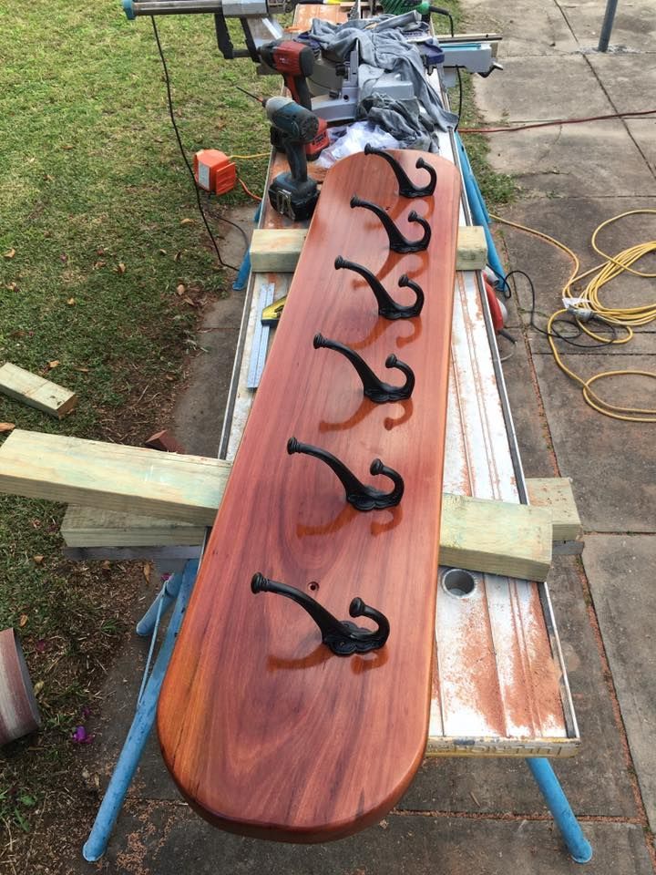A Wooden Board With Hooks on It is Sitting on a Workbench — LVL Constructions in Newcastle, NSW