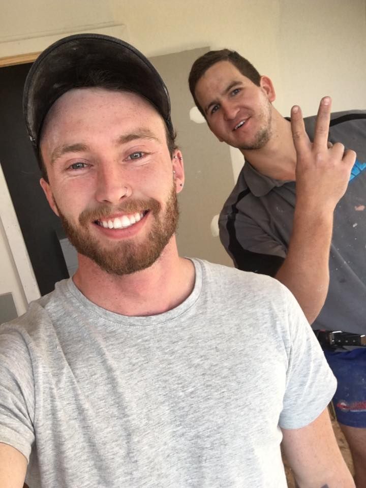 Two Men Are Posing for a Picture and One is Giving the Peace Sign — LVL Constructions in Newcastle, NSW