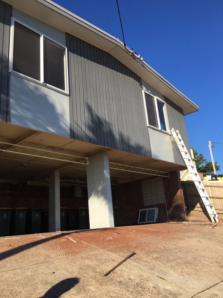 A House With a Ladder on the Side of It — LVL Constructions in Newcastle, NSW