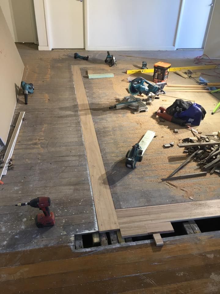A Wooden Floor With a Lot of Tools on It — LVL Constructions in Newcastle, NSW
