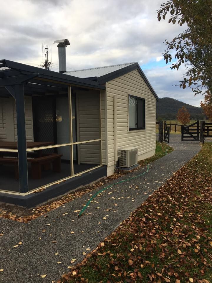 A Small House With a Porch and a Picnic Table — LVL Constructions in Newcastle, NSW