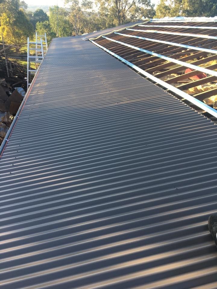 A Close Up of a Roof With a Ladder on It — LVL Constructions in Newcastle, NSW