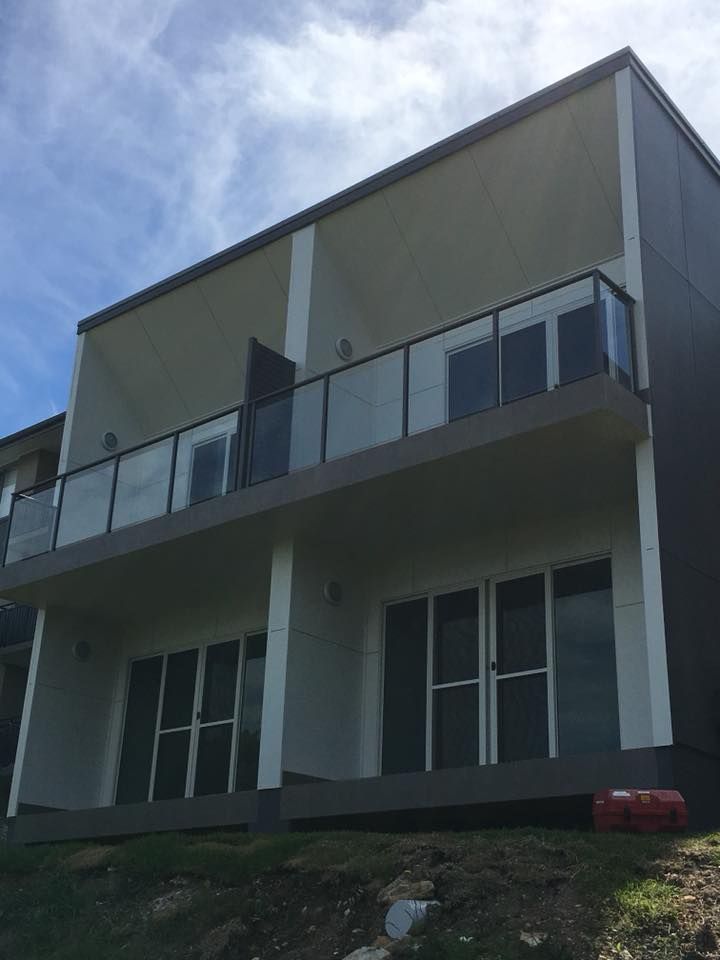 A House With a Balcony and a Lot of Windows — LVL Constructions in Newcastle, NSW