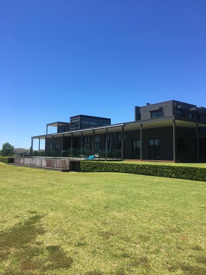 A Large House With a Large Lawn in Front of It — LVL Constructions in Newcastle, NSW