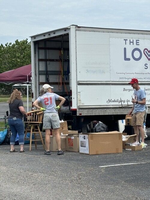 People Helping With a Moving Truck at Fairview Church of Christ's Dumpster & Fire Event in Columbia
