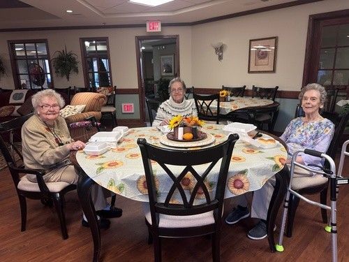 Three Women Enjoying Their Thanksgiving Dinner From Fairview Church of Christ in Columbia, MO
