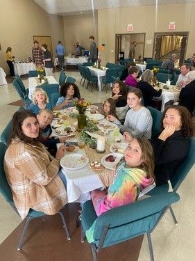 A Table of Kids Eating at Fairview Church of Christ's Thanksgiving Community Dinner in Columbia