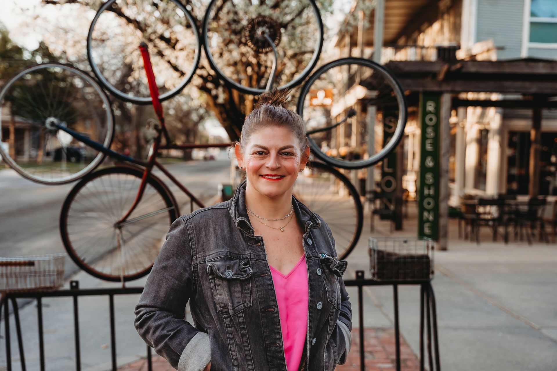 Maggie Ballard smiling while standing with her son, Paxton, highlighting her family's connection to the community.