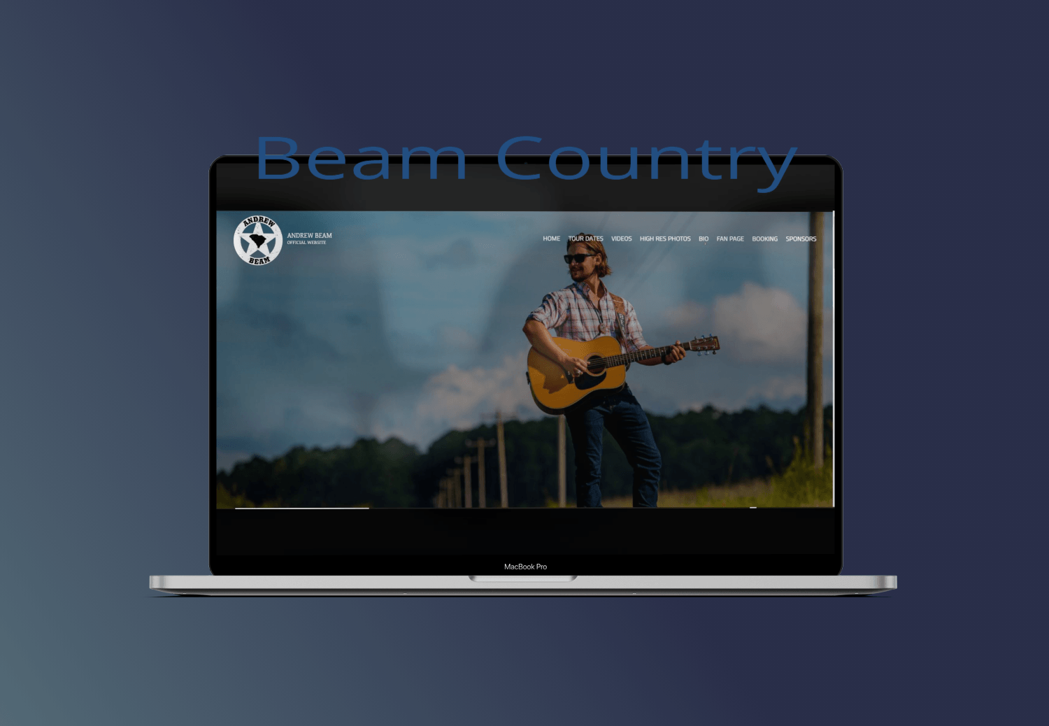 A man is playing a guitar on a laptop screen.