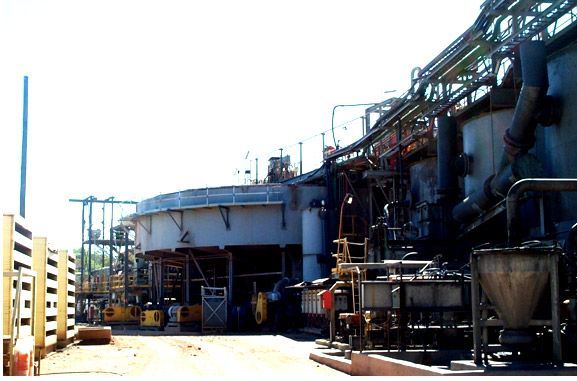 A large building with a lot of pipes going through it