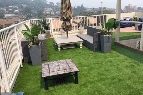 residential living space with artificial grass