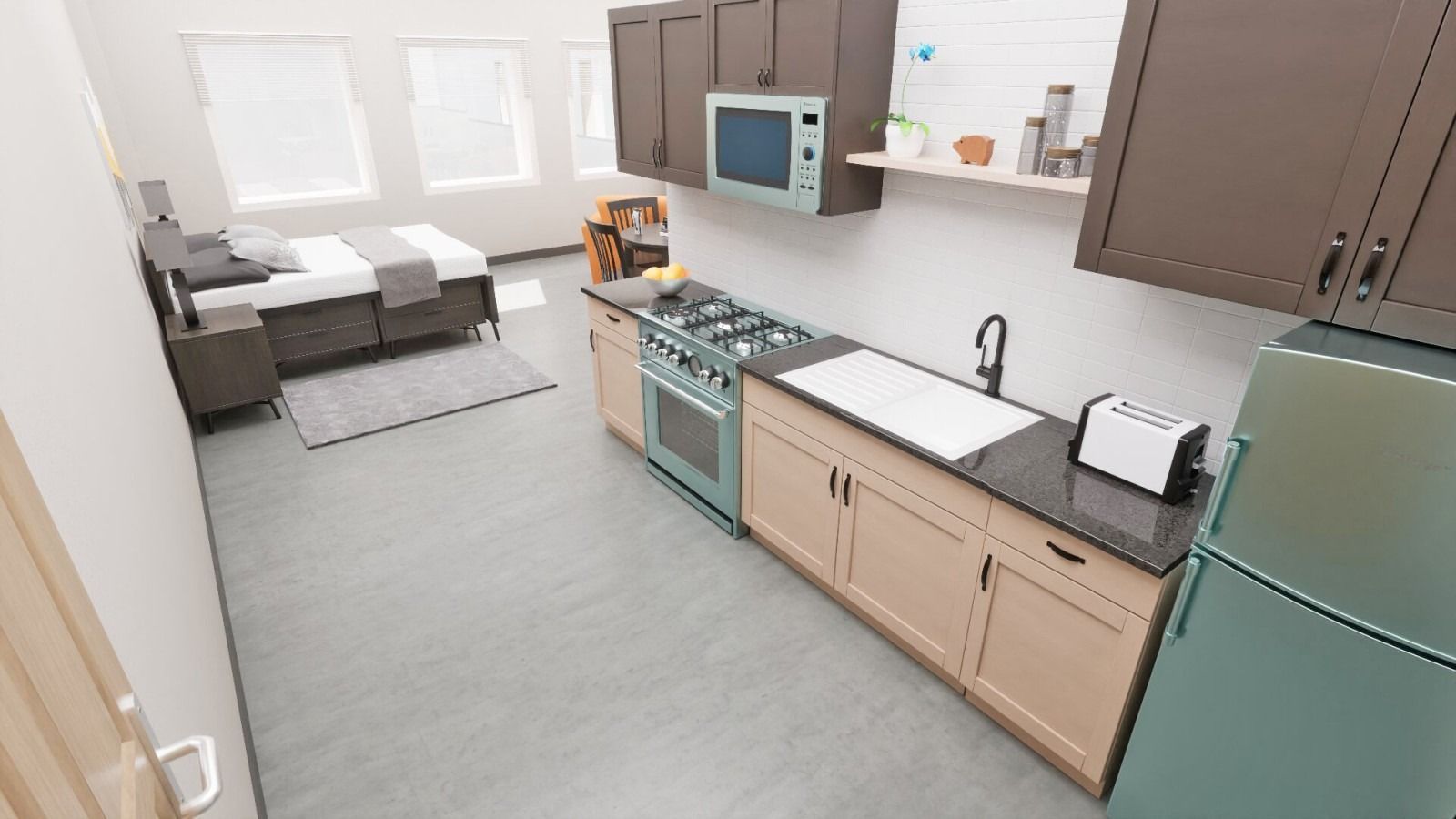 Modern studio apartment with kitchen and bed, light wood cabinets, gray floor, blue fridge.