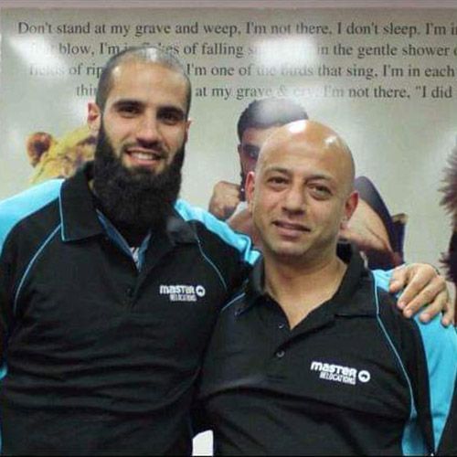 Bachar Houli and Youseff posing for a picture with one wearing a martin shirt