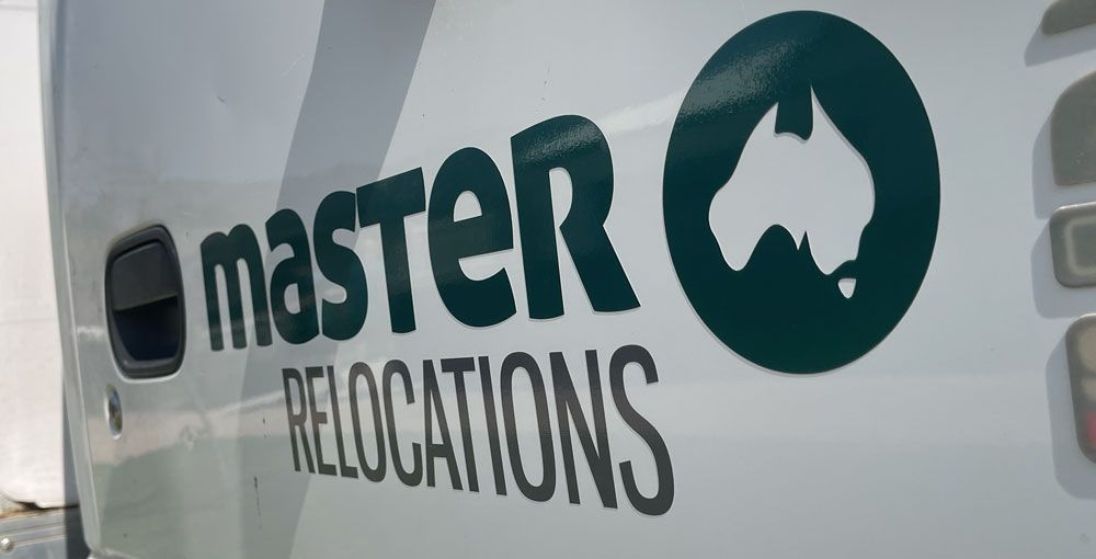 A white van with the word master relocations on it