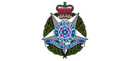 A victoria police badge with a crown on top of it.