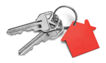A bunch of keys with a red tag in the shape of a house.