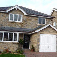 GRP white garage doors installed for a beautiful home