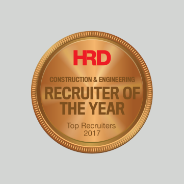 A bronze-colored award seal with the text: 