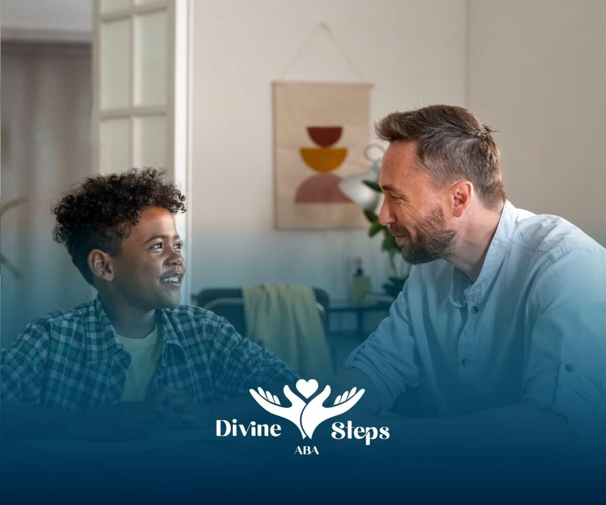 Therapist and child smiling while working together on or ABA therapy activities at home.