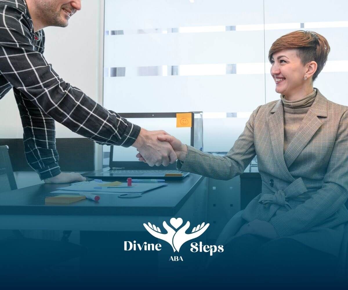 Employer shaking hands with an autistic woman in a wheelchair, symbolizing inclusive hiring.