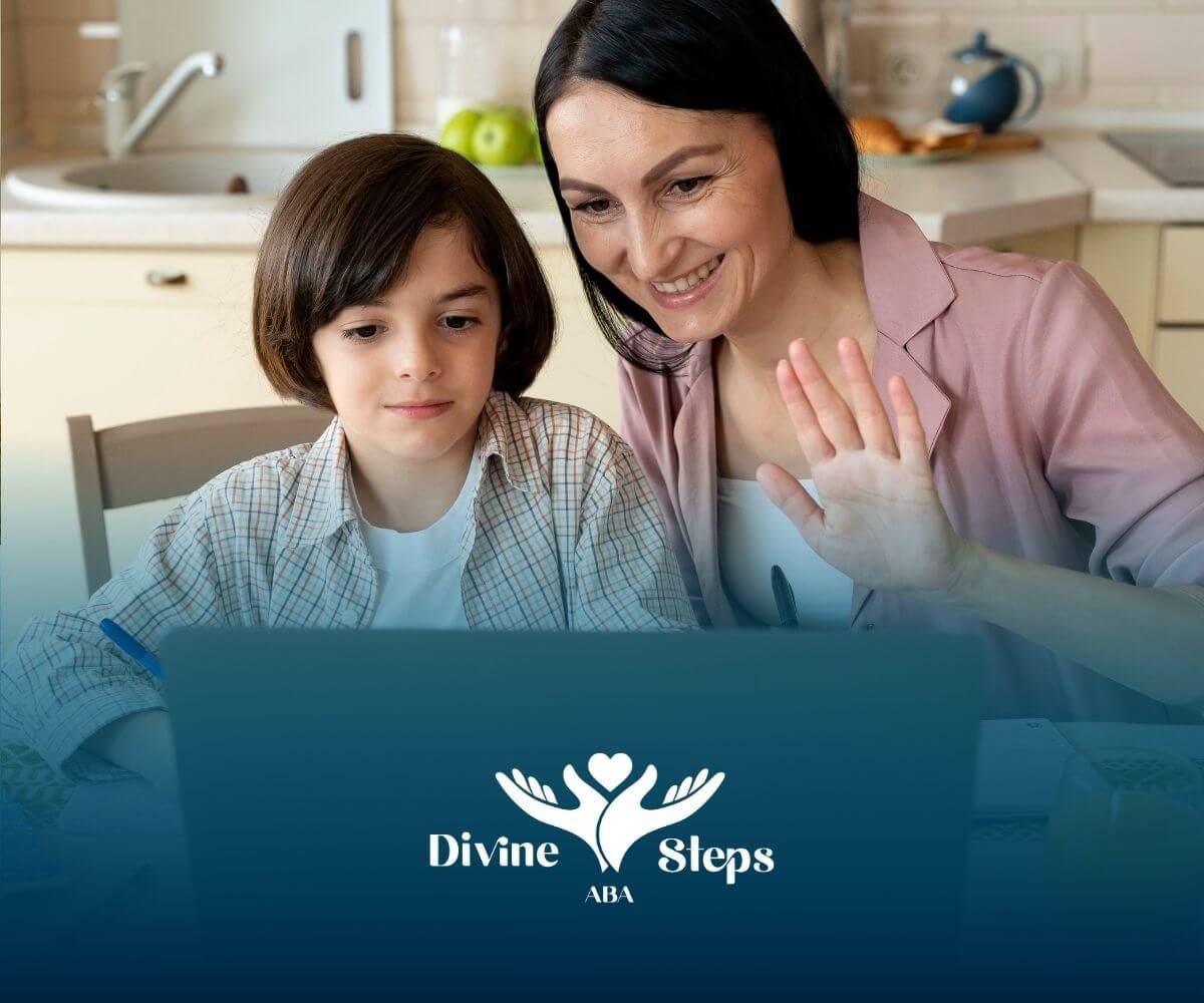 Therapist and autistic boy at kitchen table using laptop for online learning or virtual therapy.