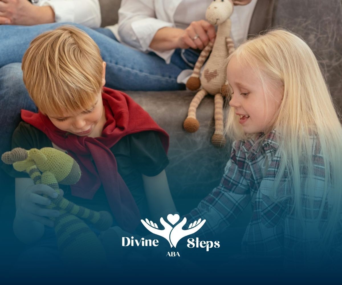 Two autistic kids playing with stuffed animals indoors and smiling during in-home ABA therapy in VA.