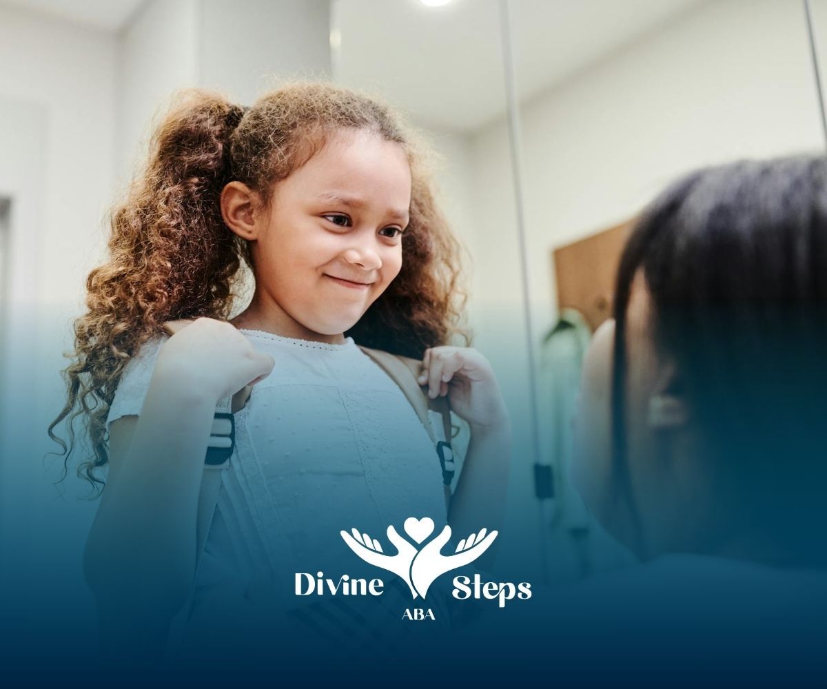 Autistic girl smiling with backpack while an ABA therapist adjusts straps during ABA therapy in VA.