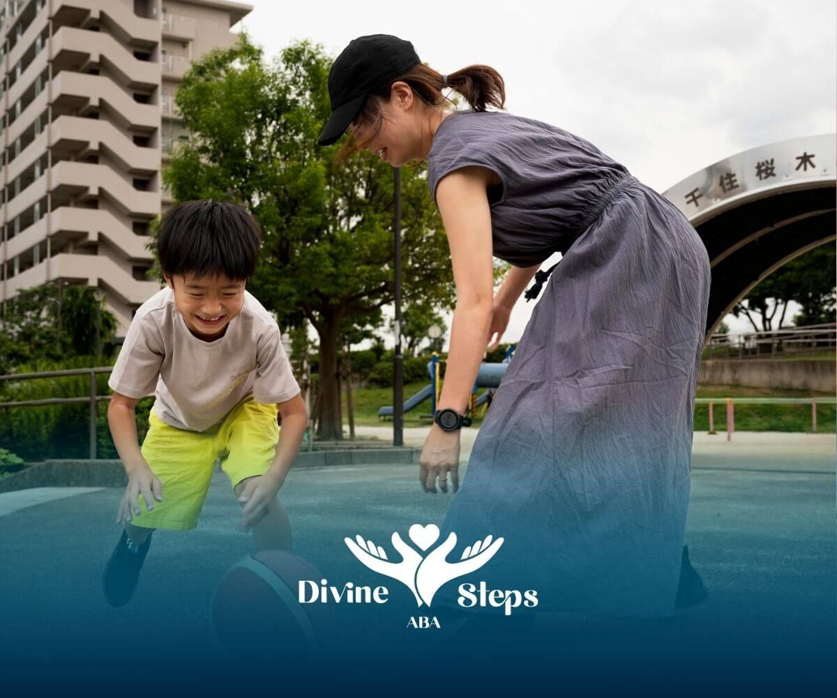 Therapist & autistic boy playing with a basketball outdoors, encouraging movement during ABA therapy