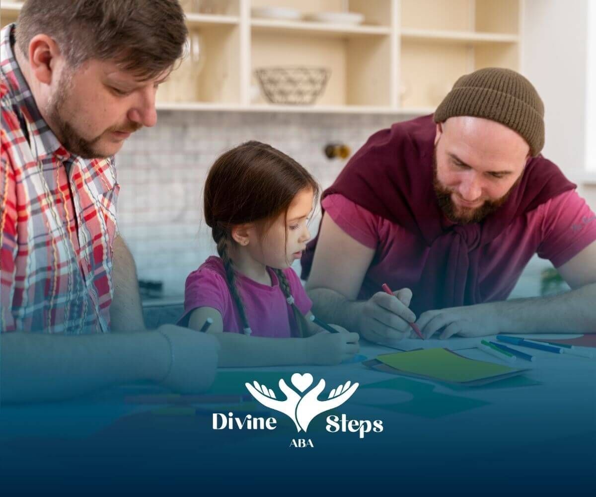 Two therapists guide autistic girl in drawing shapes with colored paper and markers