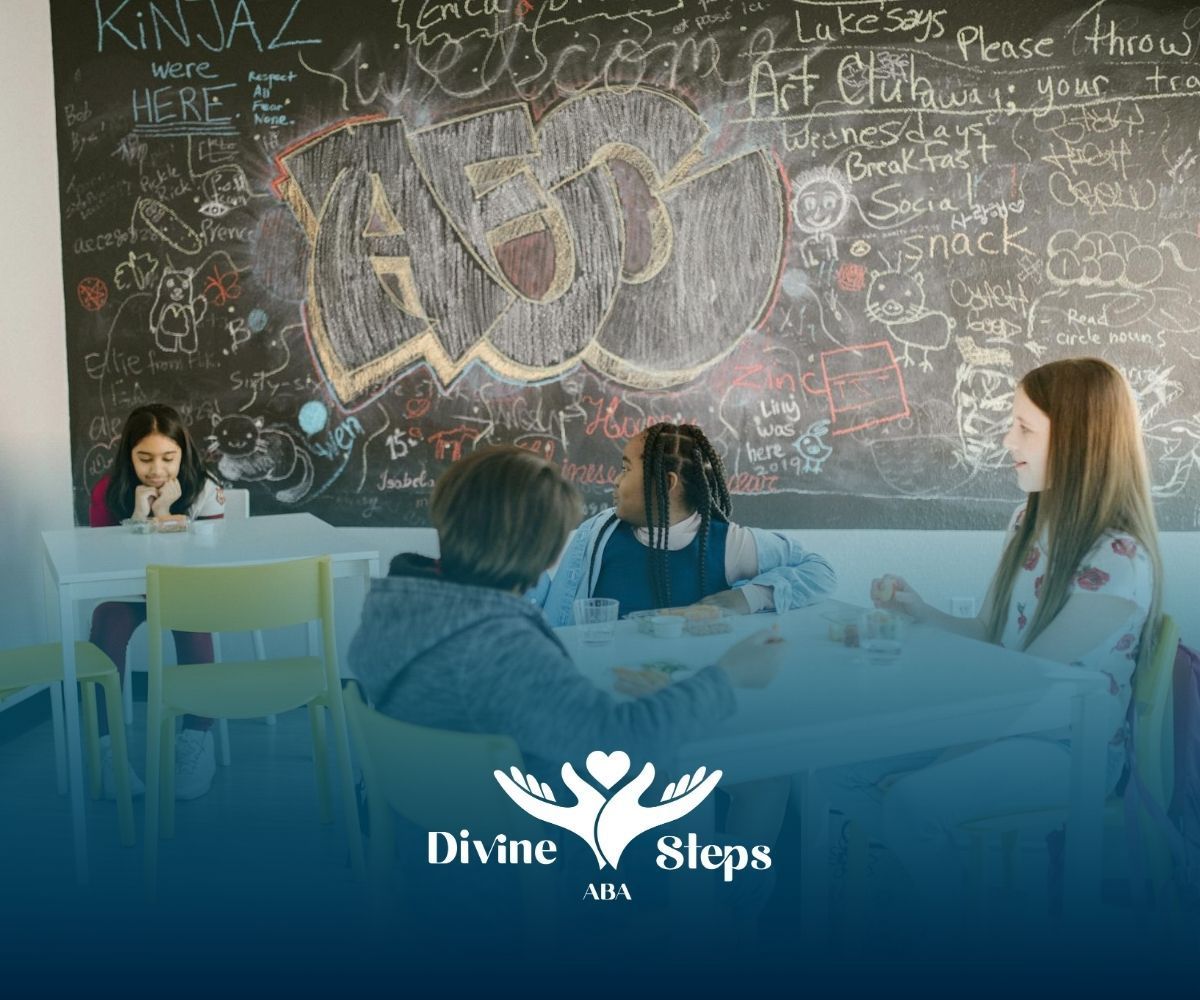 Kids sitting at tables while looking at an autistic girl in a classroom with a chalkboard wall in VA