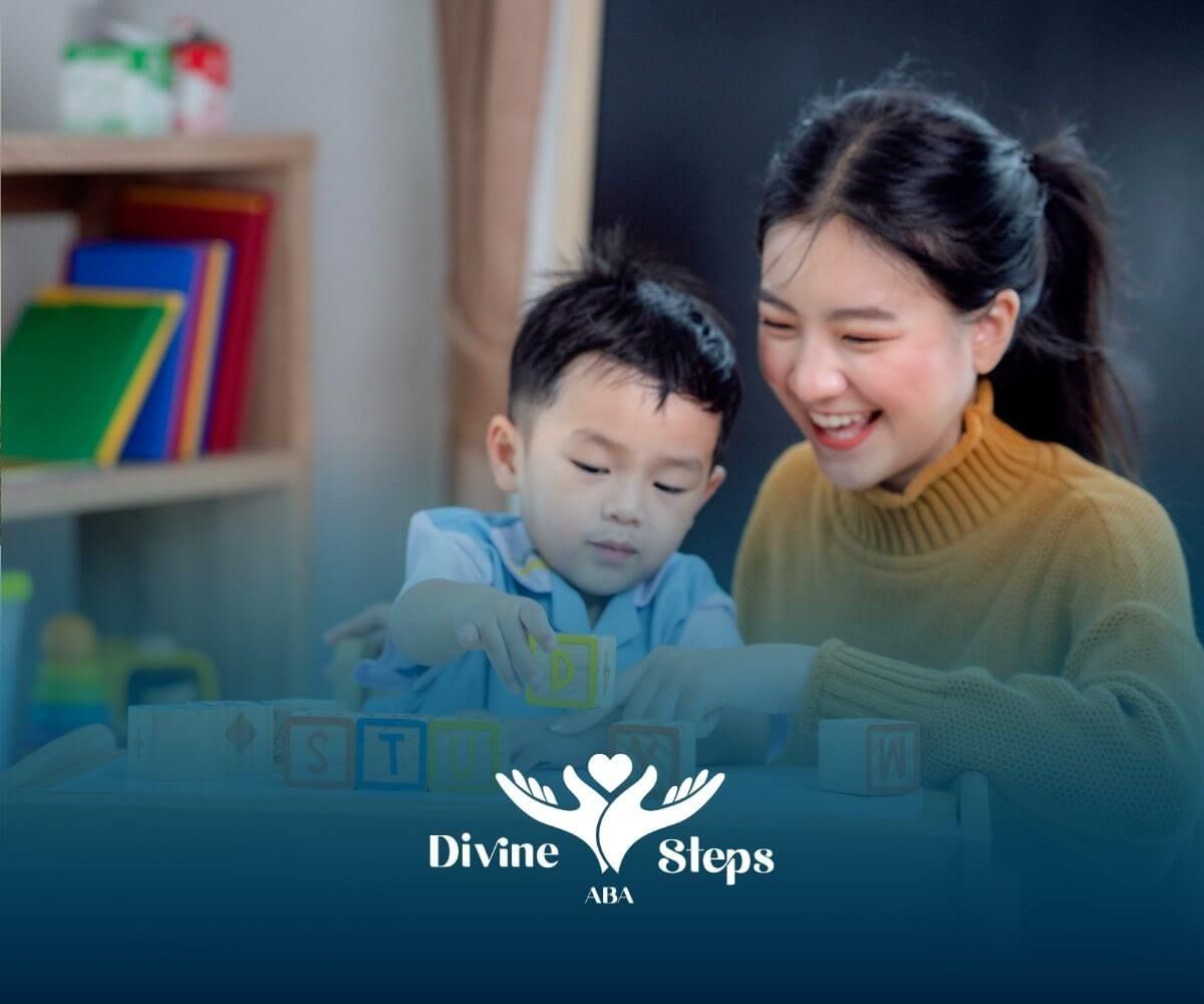 BCBA helping child with autism spell “STUDY” with wooden blocks.