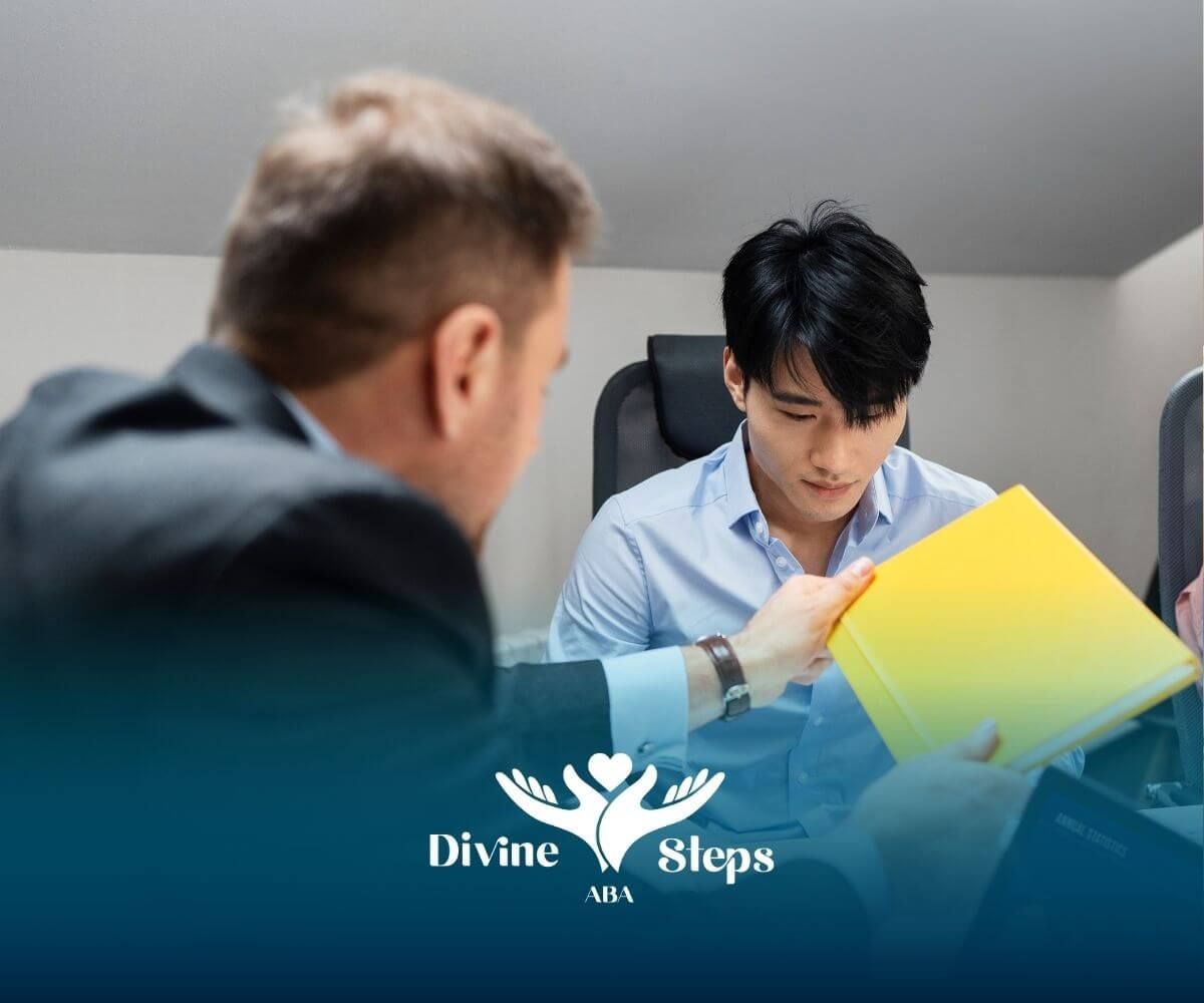 Supervisor reviewing documents with employee during training session, illustrating RBT requirements