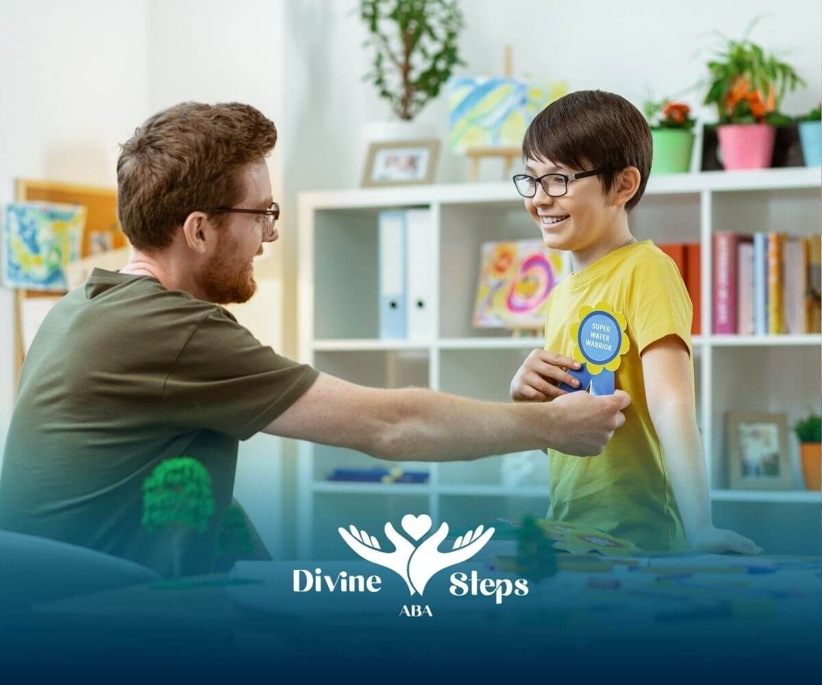 Therapist giving reward badge to autistic boy in classroom, reinforcing positive behavior.