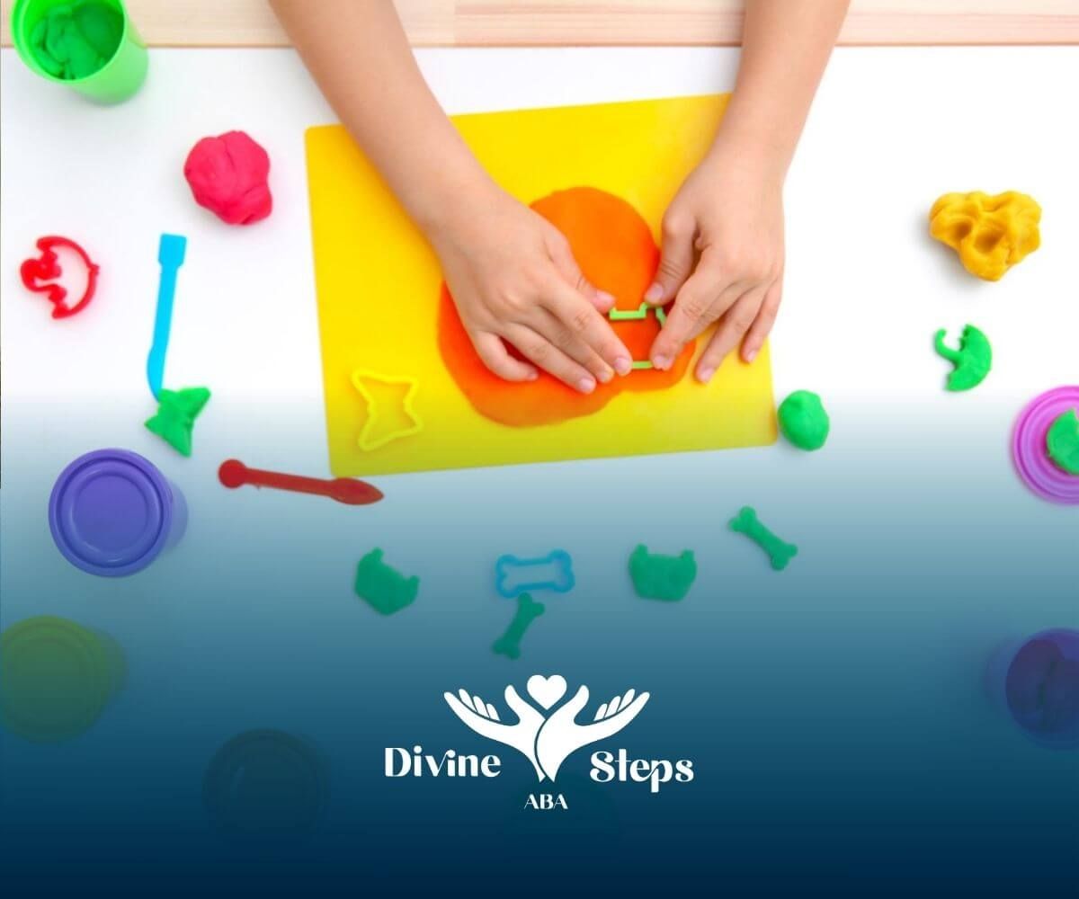 A child with autism shaping colorful playdough with cutters on a table in ABA therapy.