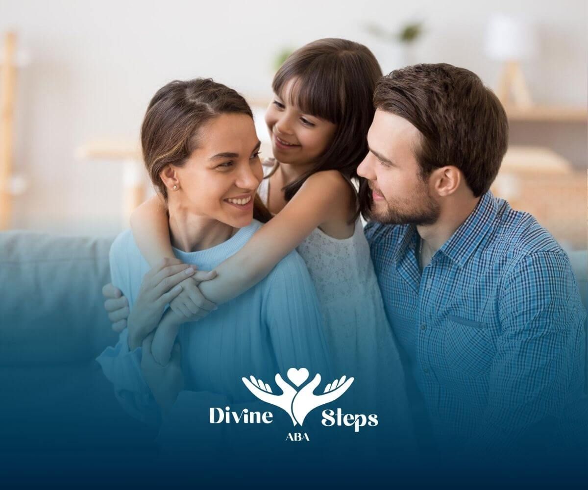 A family with an autistic child is sitting on a couch hugging each other.